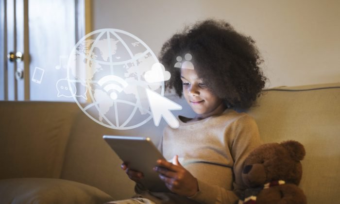 Young black girl using a digital tablet